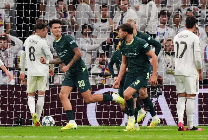 نيكو أوريلي لاعب مانشستر سيتي يحتفل بتسجيله هدف التعادل فى مرمي ريال مدريد.